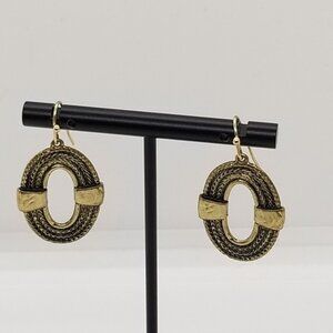 gold tone oval dangle earrings ropelike with cutout